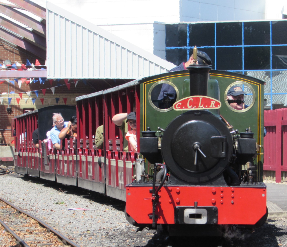 Heritage miniature locomotive with open passenger carriages at Cleethorpes
